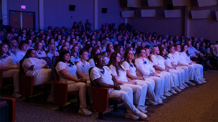 Registered Nurse Grads in the Succop Theater at the Pinning Ceremony.